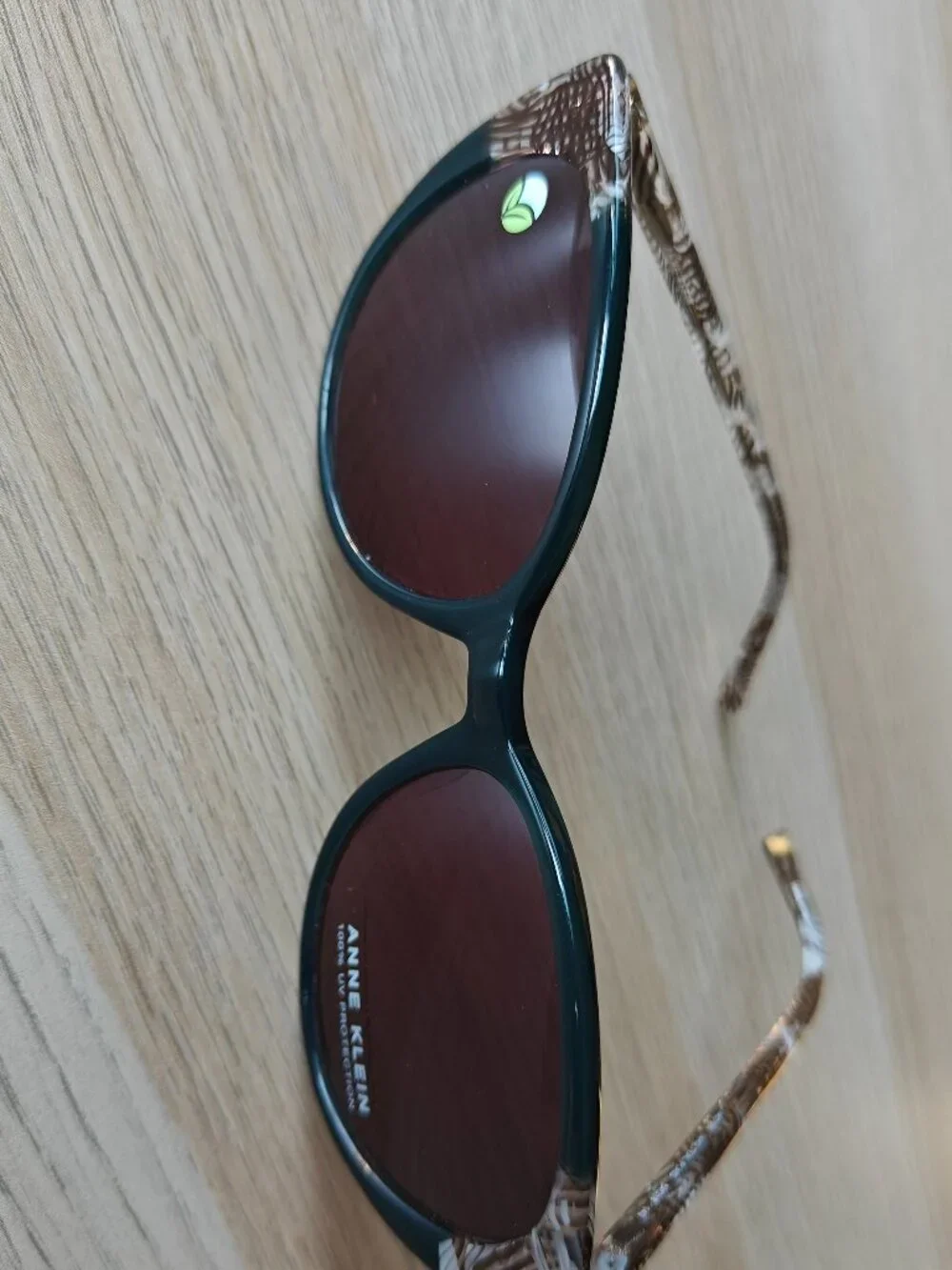 ANNE KLEIN UPLIFTING ROUNDED CAT-EYE SUNGLASSES